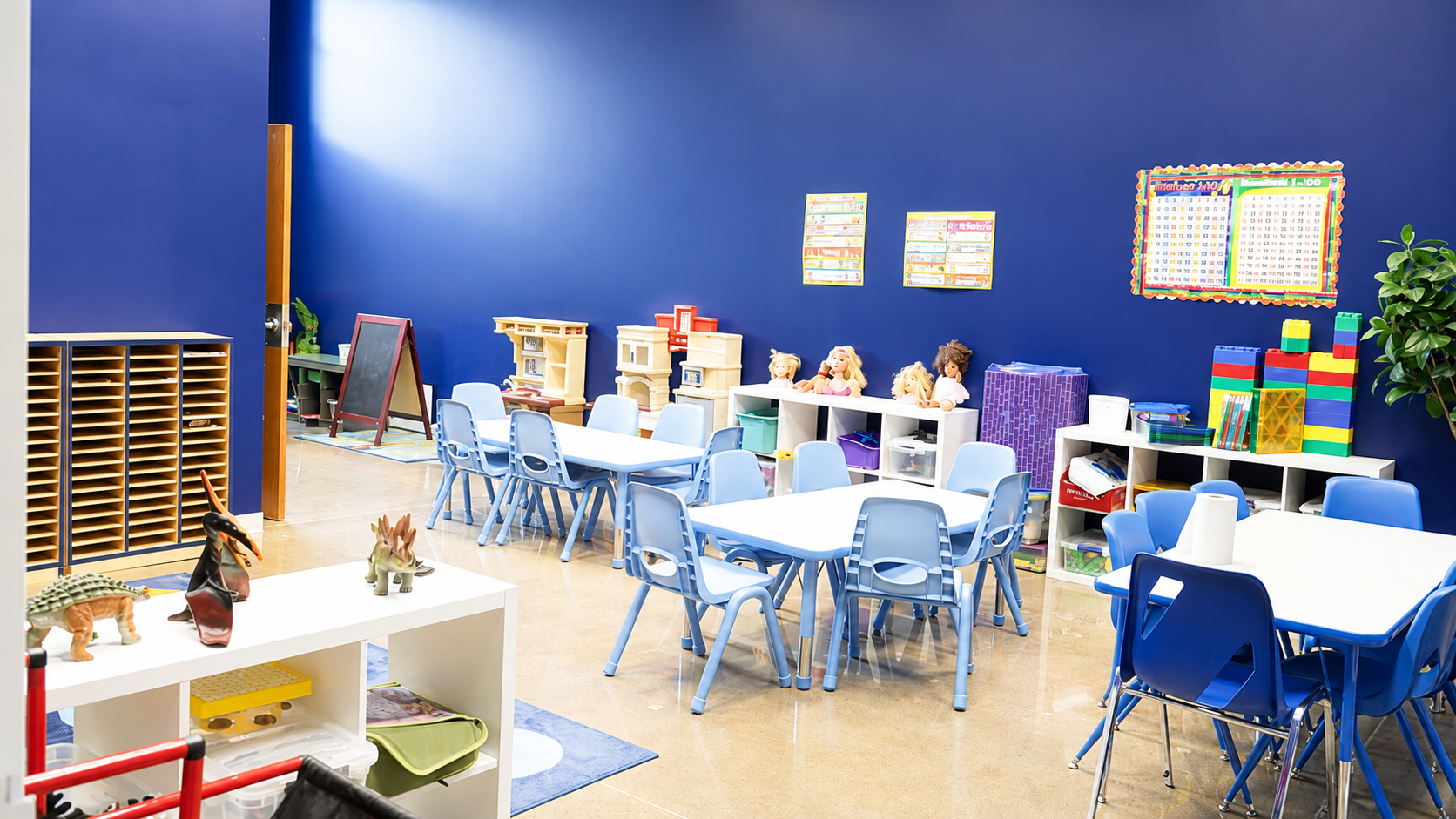 Bright classroom with child-sized tables and learning materials